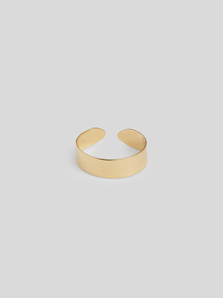 Product image of thick yellow gold band ring, ring has opening in back and isn't fully connected. Show on white background.  