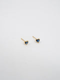 14kt Yellow Gold Heart Gemstone Studs pictured on light grey background.