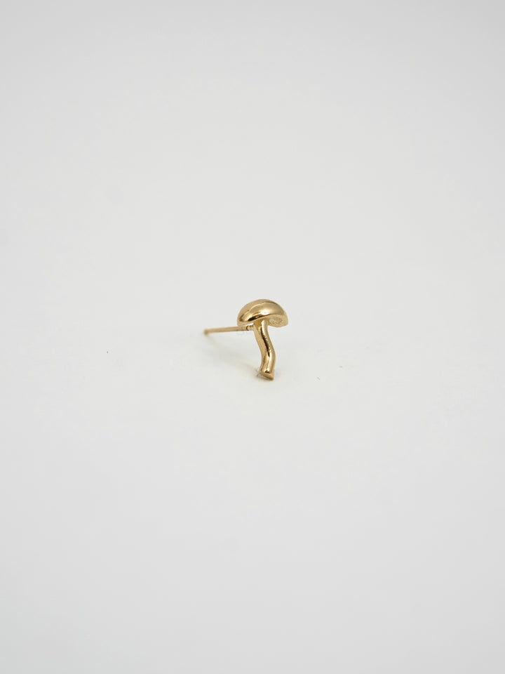 Product shot of the Shroom Stud (14kt Yellow Gold Shroom Stud 9.5x 6.8mm) background: grey backdrop