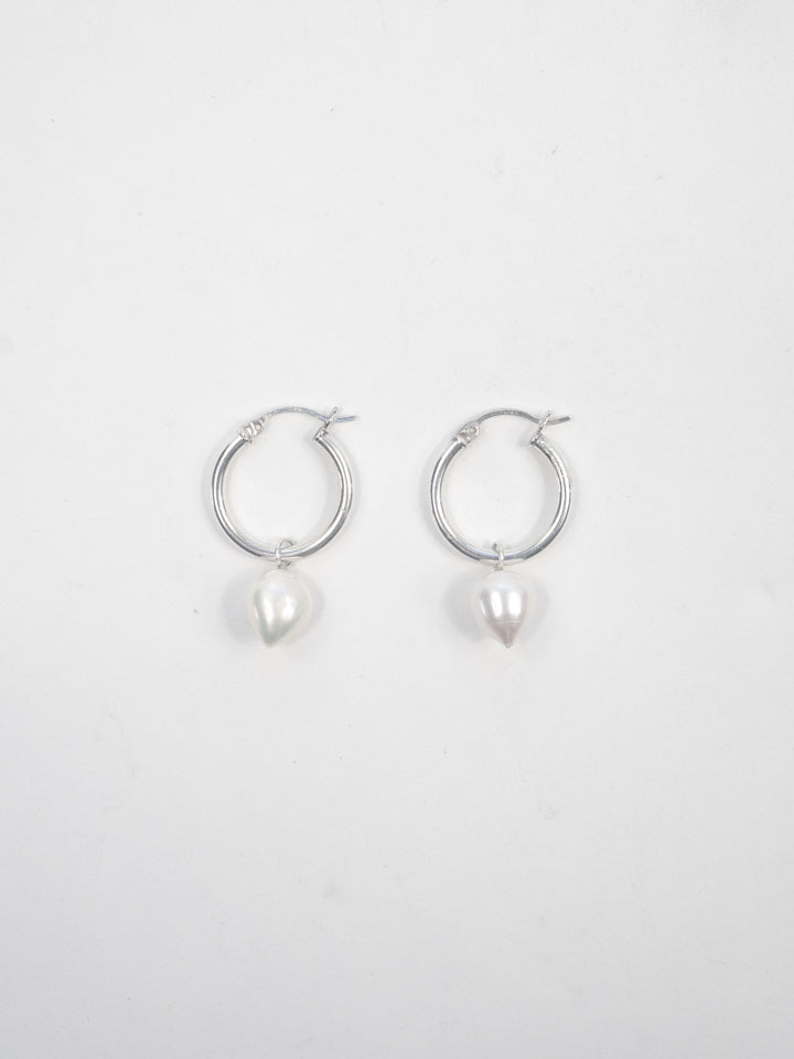 Product image of sterling silver hoops with pearl pendants on white background