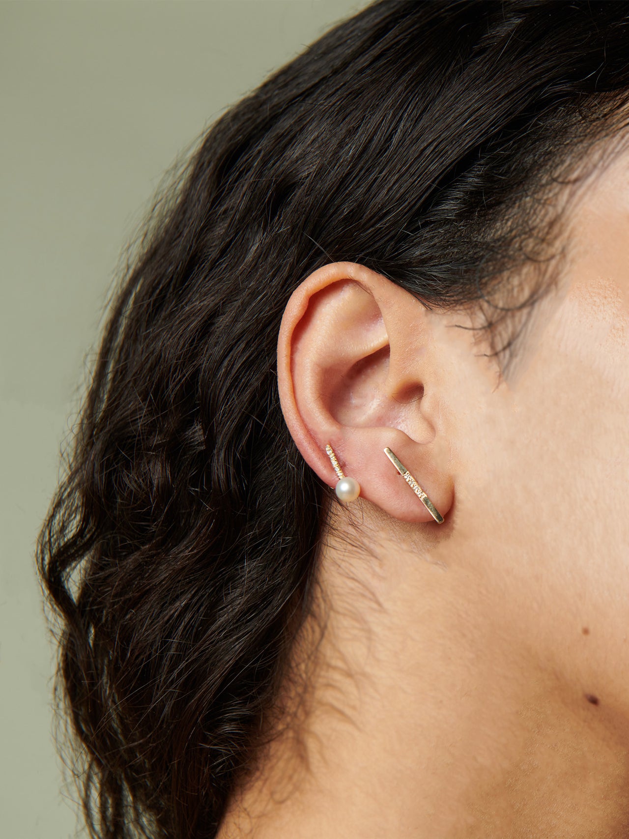 14kt Yellow Gold Diamond Rod Stud Earring pictured on model.