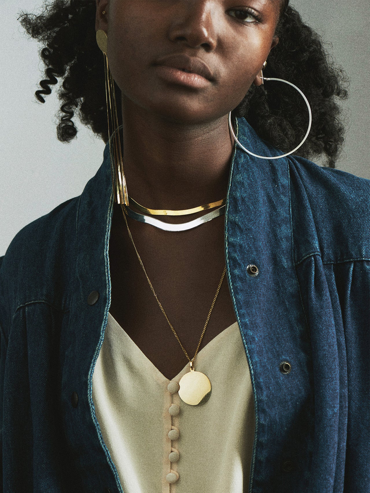 Sterling Silver XL Infinity Hoops pictured on model. 