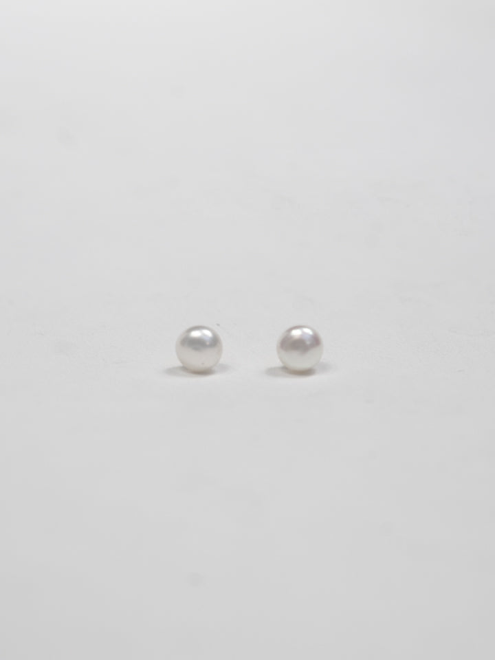 Product image of pearl stud earrings on white background