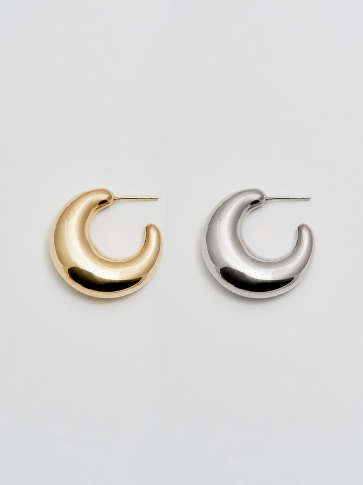 Vermeil & Sterling Silver Crescent Moon Earrings pictured on light grey background.