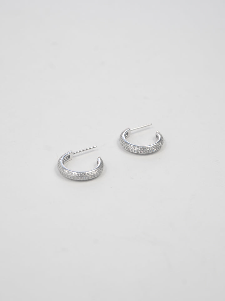 Product image of Sterling Silver Pave Huggies shot on white background. 