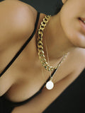 Close up on Model shot wearing the XXL Curb Chain Necklace (Vermeil XL Diamond Cut Curb Chain Necklace Width: 13mm Length: 16") Background: Black 