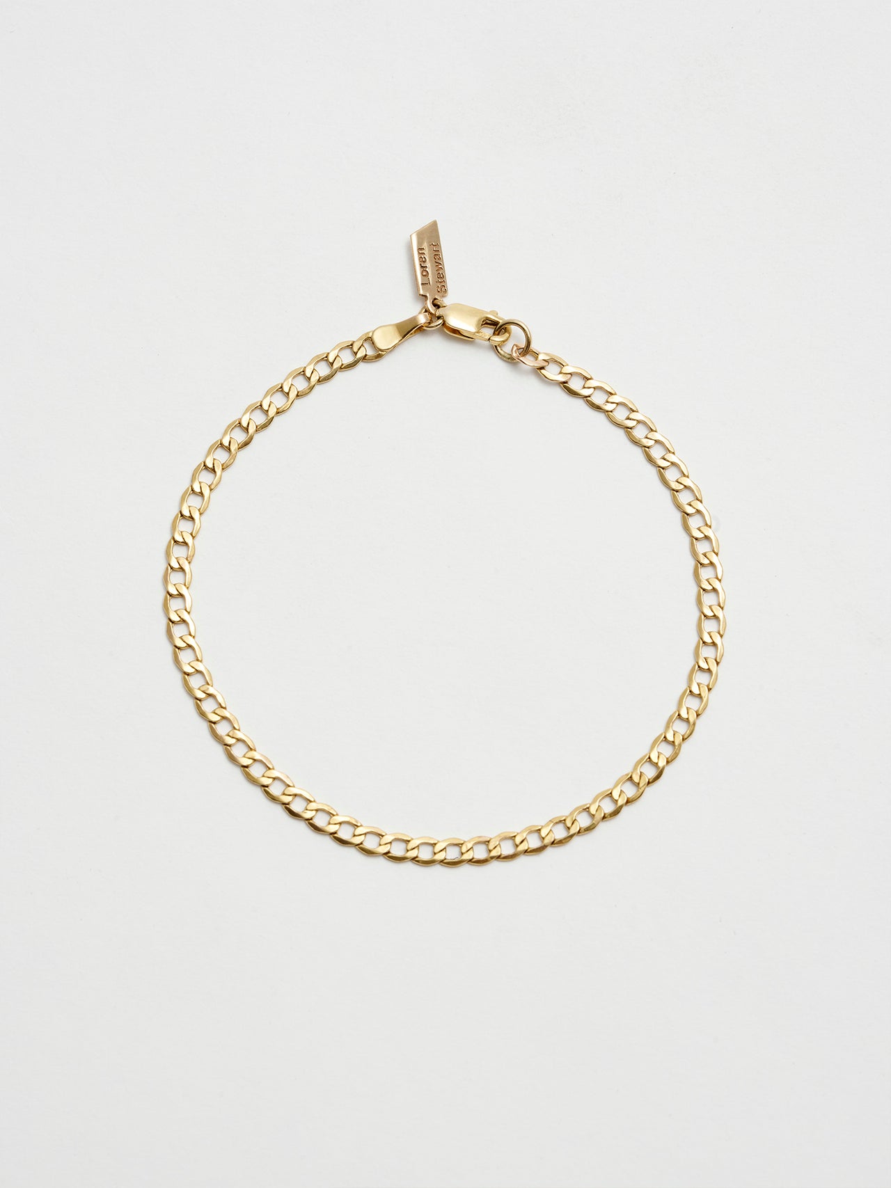 XL Lightweight Havana Chain Bracelet: 14Kt Yellow Gold-Plated Sterling Silver Hollow Chain Bracelet Length: 7” Width: 3.3mm