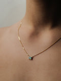on model image of emerald cut bezel necklace
