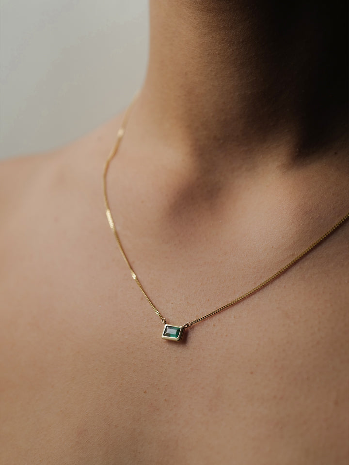 on model image of emerald cut bezel necklace
