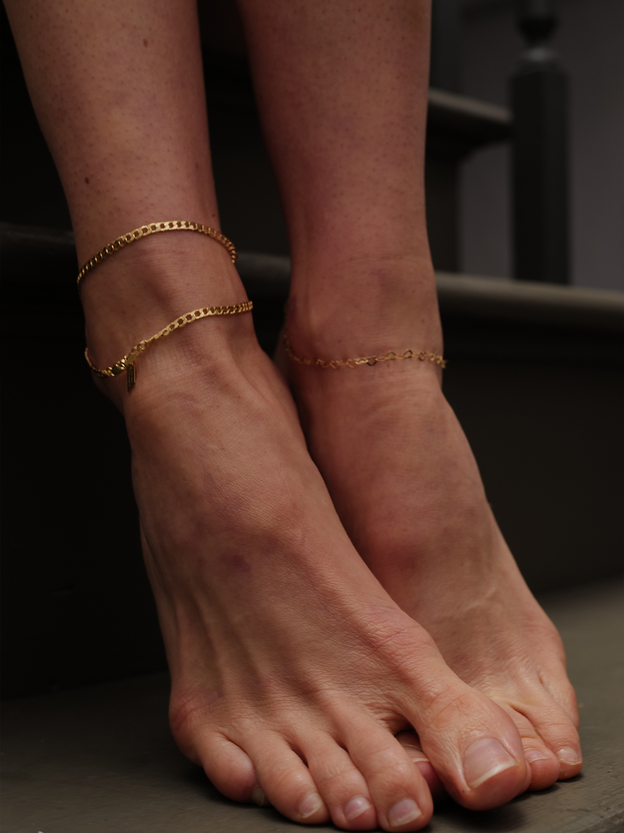on model imagery of yellow gold love links anklet