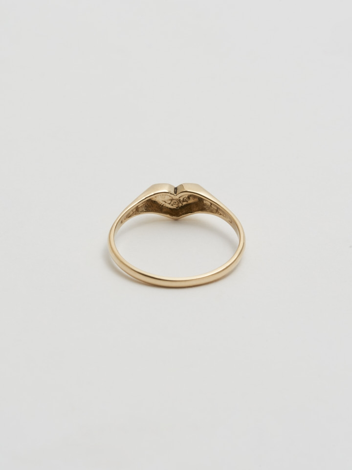 Back angle shot of the Mini Heart Signet (14Kt Shiny Yellow Gold Ring with 5mm Mini Heart Face) with white background