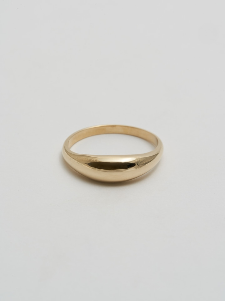 Product Shot of Dome Ring (Shiny 14Kt Yellow Gold Dome Ring with a 5.3mm to 1.9mm Tapered Width) shot on white background