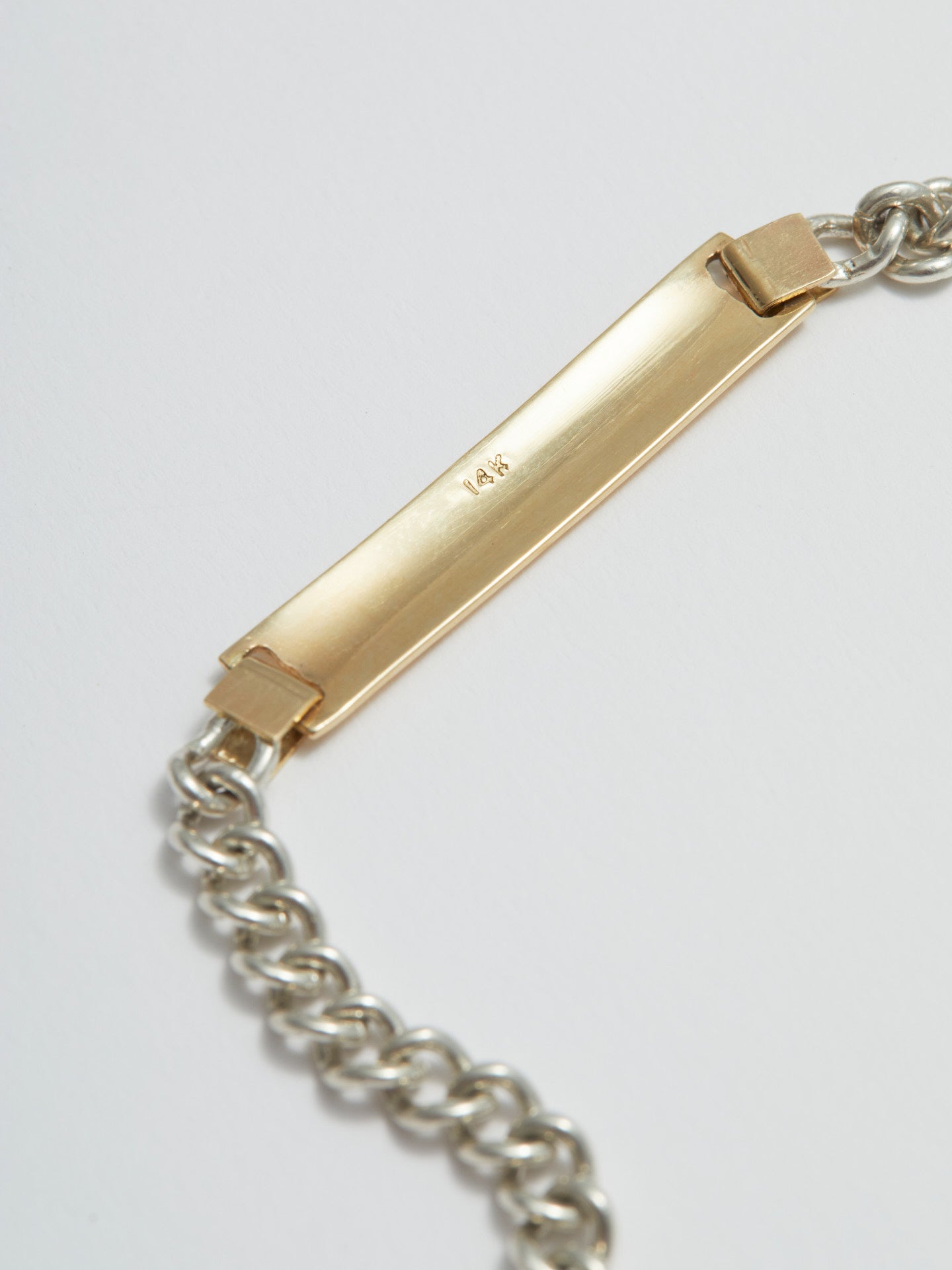 Close up of ID bar showing "14k" stamp on back 