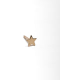 close up of 14kt Yellow Gold Mini Star Stud pictured on light grey background. 