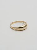 Side angle product shot of Dome Ring (14Kt Yellow Gold Dome Ring with a 5.3mm to 1.9mm Tapered Width) shot on white background