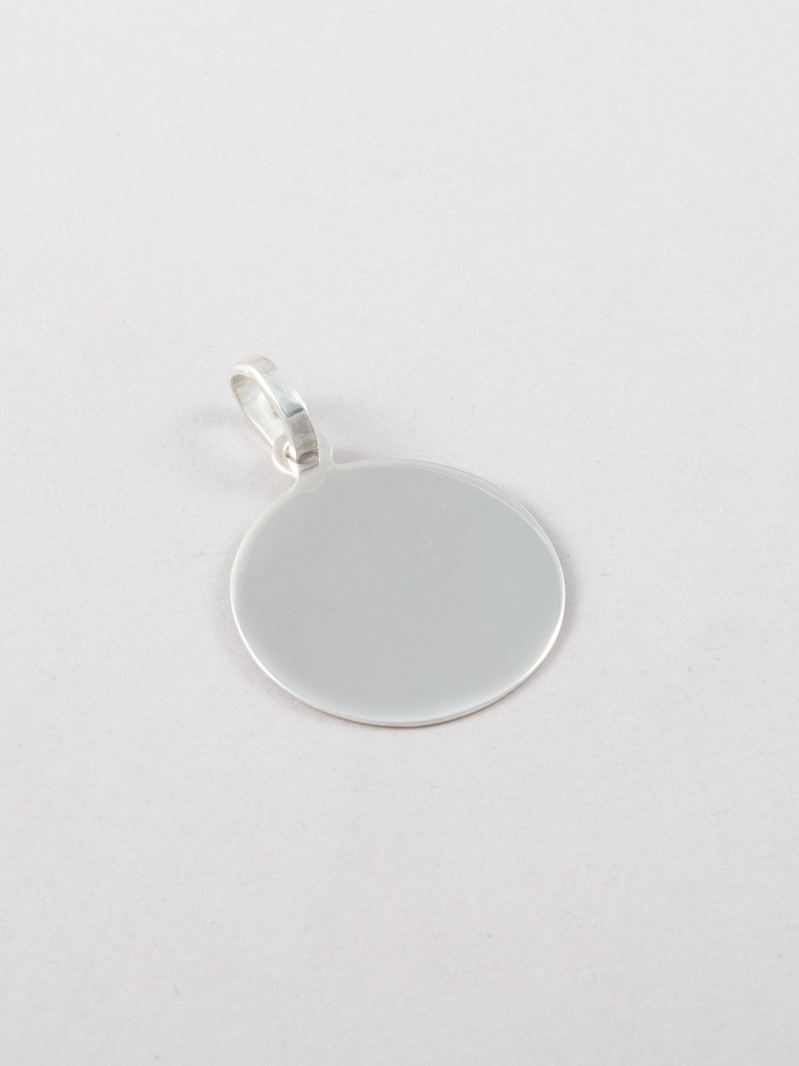 Sterling Silver Disk Pendant pictured on grey background.